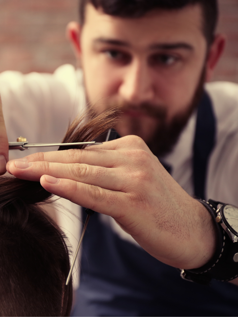 Professional working with hair tools